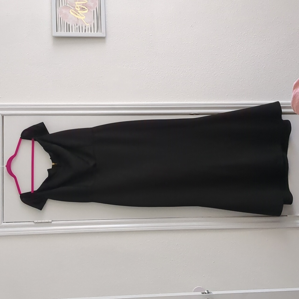 Black mermaid shaped evening gown.